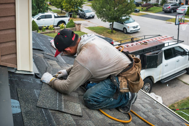 Professional Gutter Installation technician working in Seattle, WA